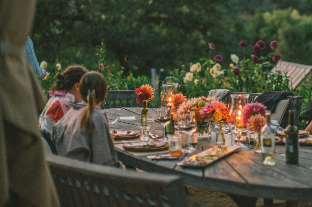 Two women at an outdoor dining table in the Sonoma County Redwoods